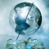Glass globe with stacks on US paper currency underneath