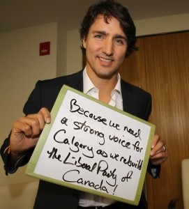 Liberal Party of CanadaÕs leadership candidate, Justin Trudeau, holds up a message for Liberal candidate, Harvey Locke's tumblr account after speaking to students at Mount Royal University in Calgary for a Q and A sponsored by Policy Studies Students' Society at the Wyckham House at MRU on Tuesday Nov 20, 2012. Darren Makowichuk/Calgary Sun/QMI AGENCY